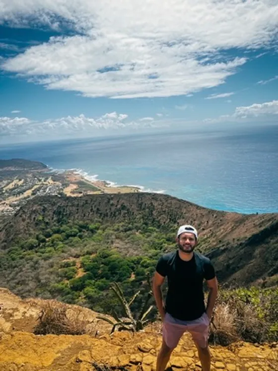 Prateek at the Koko Head summit on Oahu, ocean behind him.
